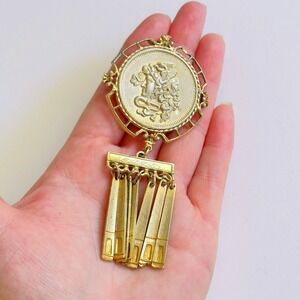 Elegant Gold Brooch with the emblem of Medusa.